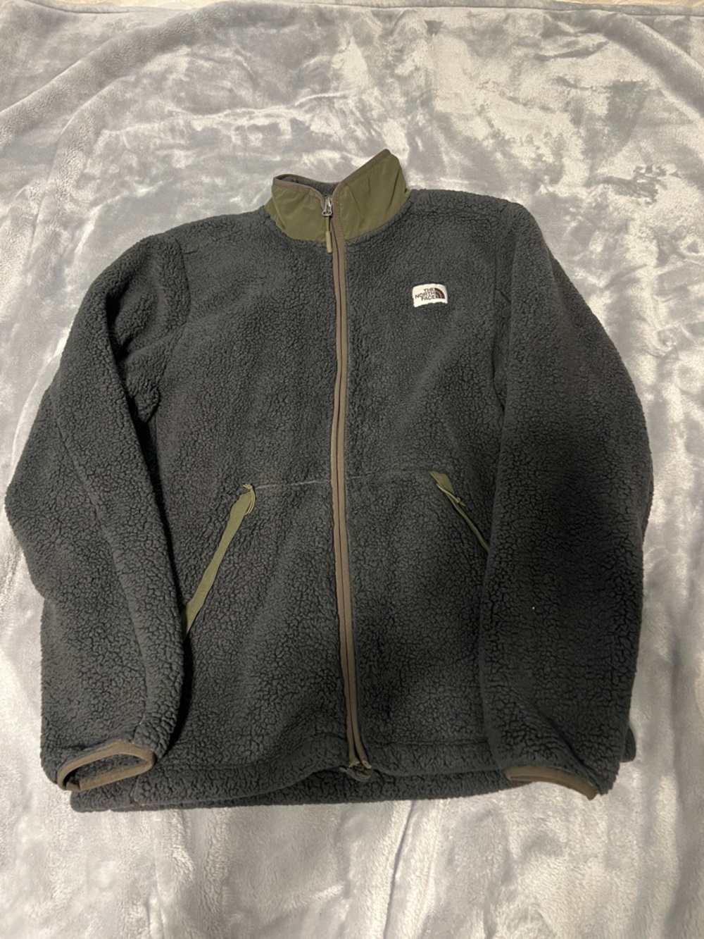 The North Face Men’s Black Sherpa Fleece Jacket with Olive Trim